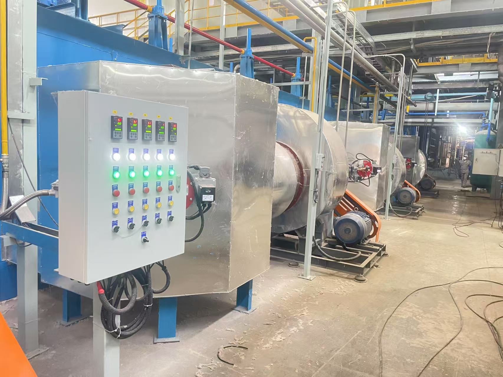 Multiple combustion systems installed along industrial processing line