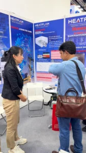 HEATFLAM team member speaking with a visitor at the IRGCE 2026 booth