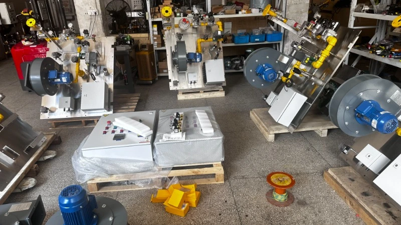 Engineer assembling an industrial combustion system for feed drying, with visible piping and valves.